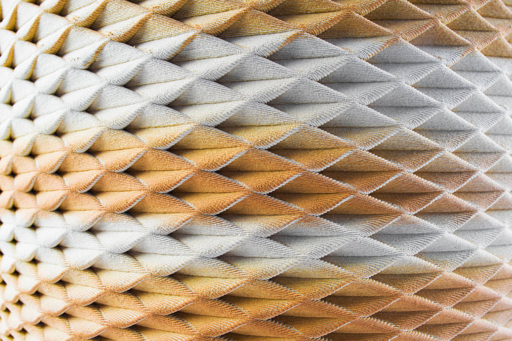 Close-up of layered white and terracotta ceramic texture